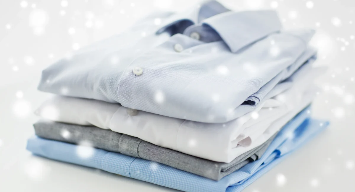 ironing-laundry-clothes-housekeeping-objects-concept-close-up-ironed-folded-shirts-table-home-snow-effect
